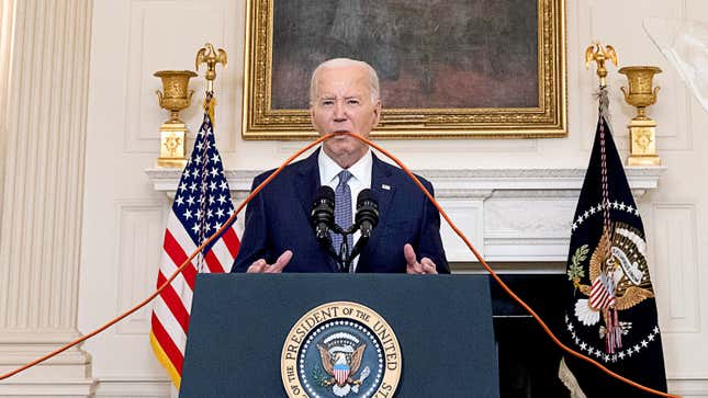 Image for article titled Biden Spends Press Conference Gnawing On Extension Cord